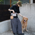 Pawsbetter Everyday Dog Walking Crossbody Bag, lightweight crossbody walking bag with divided storage, outdoor dog walk scene